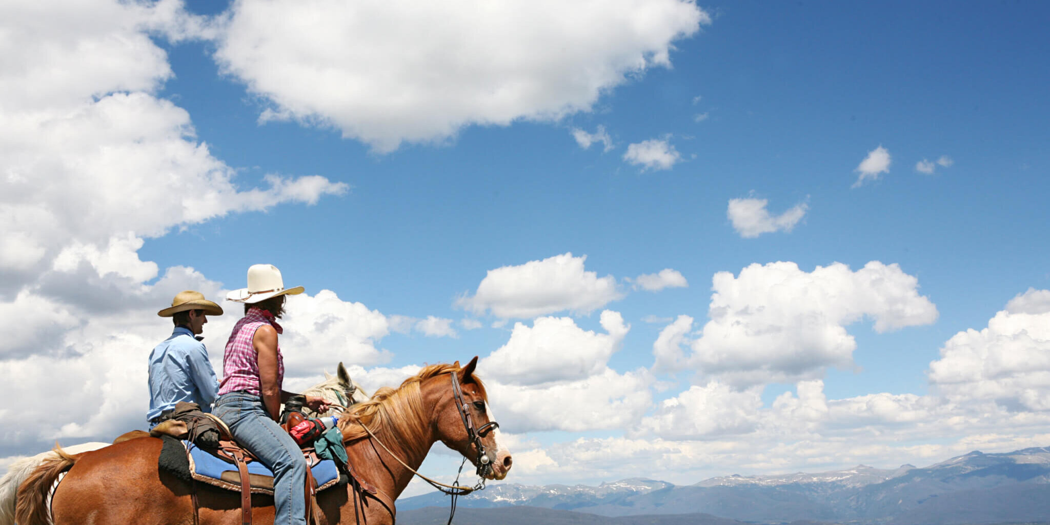 Man and Woman Riding
